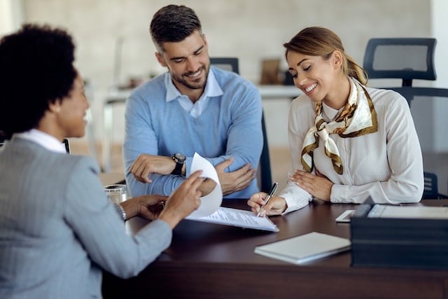 Property manager presenting documents to clients.